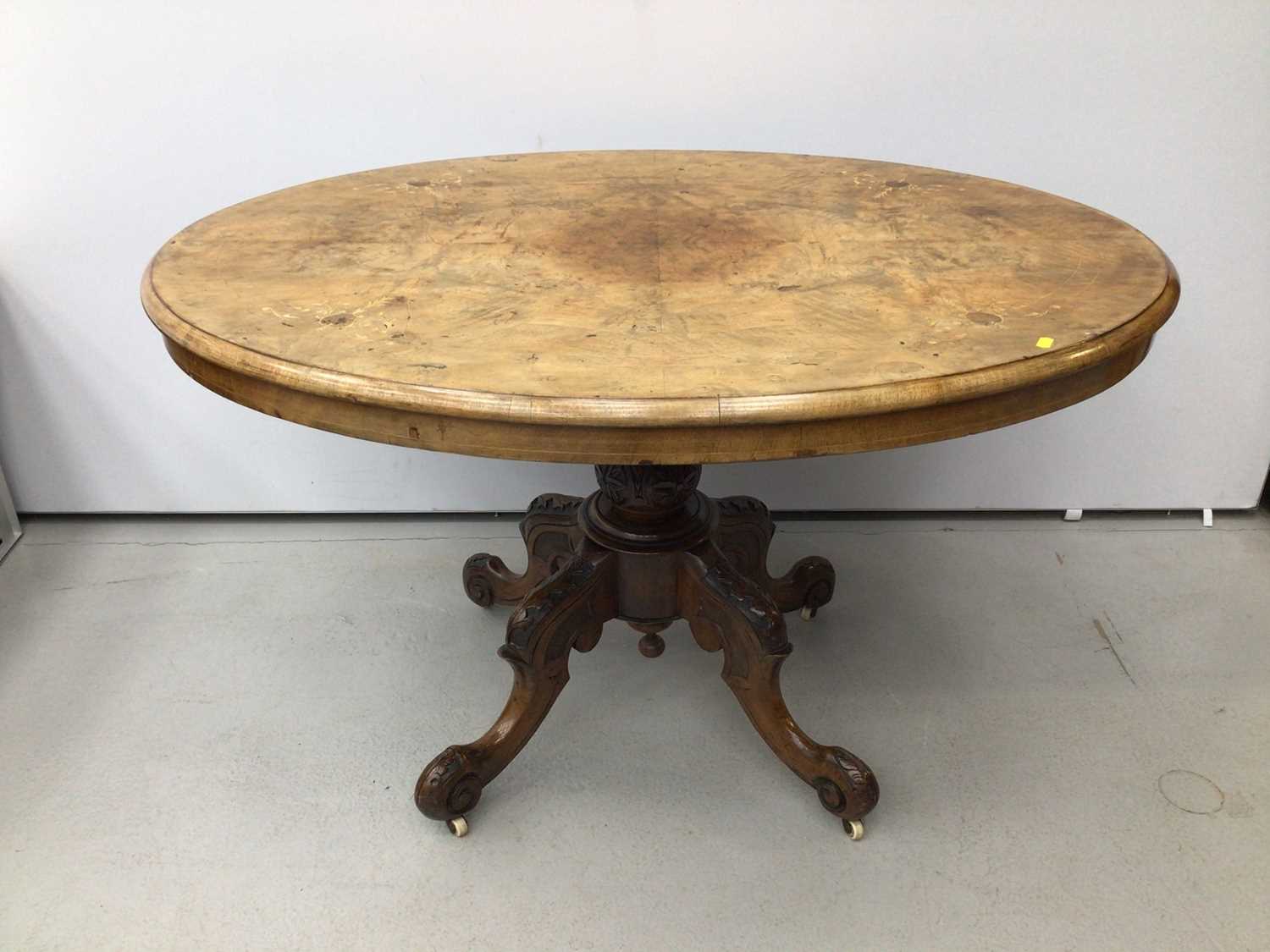 Lot 35 - Victorian inlaid walnut oval loo table