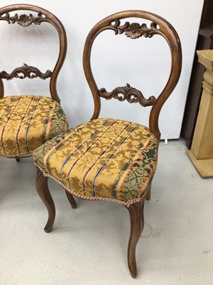 Lot 34 - Set of four Victorian walnut balloon back chairs