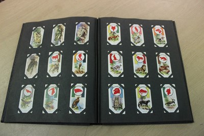 Lot 254 - Cigarette cards selection including Wills Cricketers, Clarkes Ogdens Jockeys, Famous Rugby Players, Racing Pigeons etc plus an album of scraps