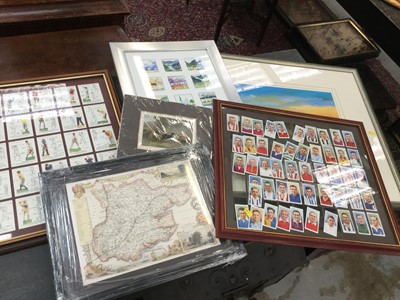 Lot 98 - Players Association footballers cigarette cards, together with other cards in a glazed frame, reproduction map and other prints