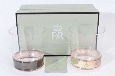 Lot 66 - H.M.Queen Elizabeth II 2010 staff Christmas present - pair of glass tumblers with silver plated  collars engraved with Royal ciphers