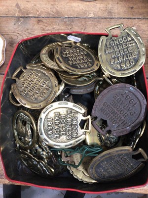 Lot 25 - Collection of 19th century and later horses brasses to include London Harness Horse Parade, various years spanning 1967-2003, other Shire Horse brasses, some mounted on leather, approximately 60