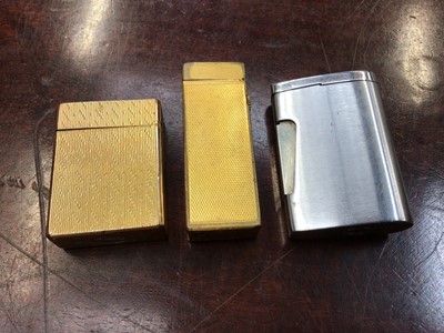 Lot 112 - Vintage Dunhill gold plated pocket lighter, Dupont pocket lighter and a Ronson lighter (3)