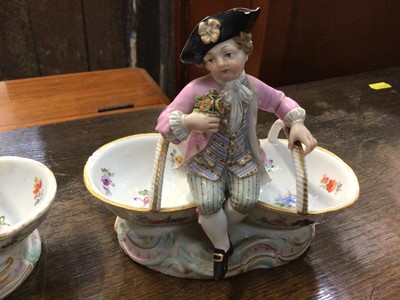 Lot 117 - Pair of 19th century Meissen porcelain baskets with figure mounts, blue crossed swords and impressed marks to base