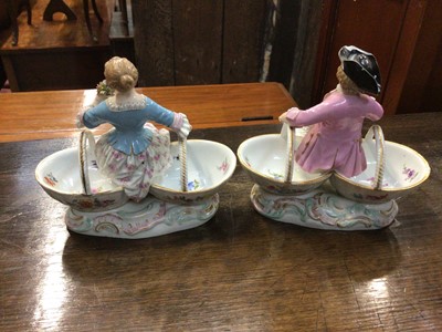 Lot 117 - Pair of 19th century Meissen porcelain baskets with figure mounts, blue crossed swords and impressed marks to base