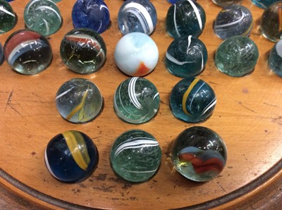 Lot 30 - Vintage solitaire board and two sets of marbles