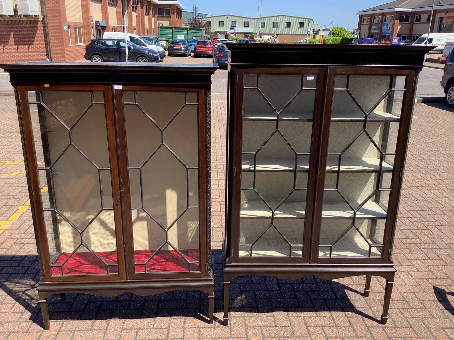 Lot 133 - Near pair of Chippendale style display cabinets
