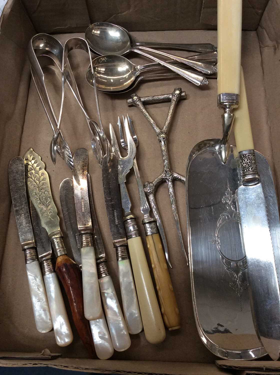 Lot 696 - Two pairs of silver sugar nips, set of six silver teaspoons, various plated cutlery