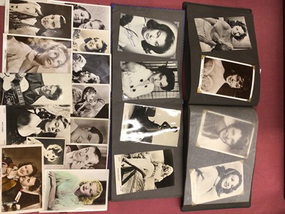 Lot 1327 - Postcards and photographs of 1940s/50s film stars including Jane Russell, Marilyn Monroe,, Ava Gardner, Rita Hayworth