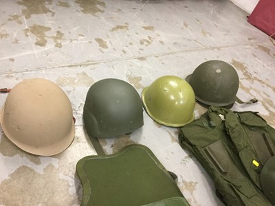 Lot 790 - Group of modern military helmets, together with body armour and other military uniforms