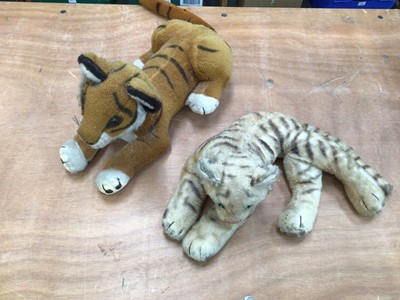 Lot 1734 - Two Steiff mohair tigers (one large one small) with button in ear, and one Merrythought tiger