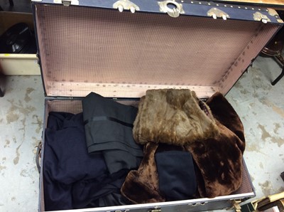Lot 356 - Large vintage travelling trunk containing gentlemen’s suits, fur etc