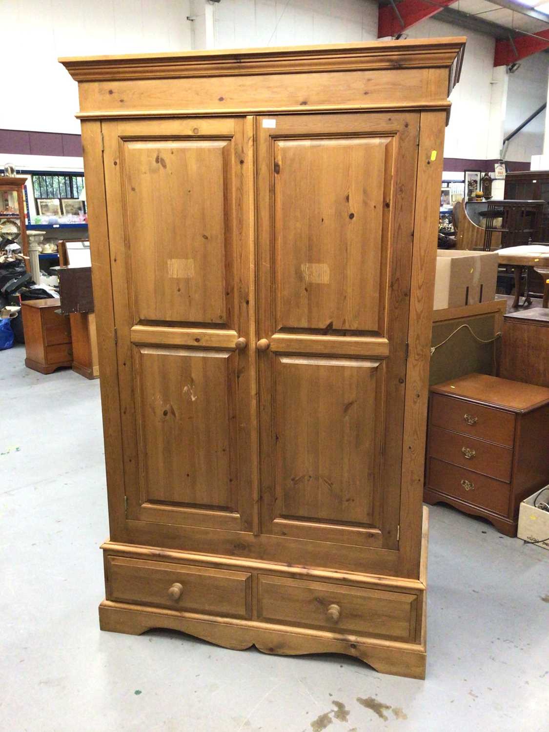 Lot 884 - Pine wardrobe with two panelled doors and