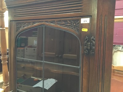 Lot 874 - Old Charm carved oak two height corner cabinet with leaded glazed door and linen fold door below 182 cm high, 72 cm wide