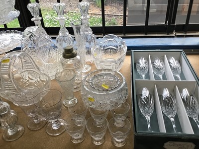 Lot 200 - Collection of cut glass and pressed glass wares to include decanters, cake stands and other pieces