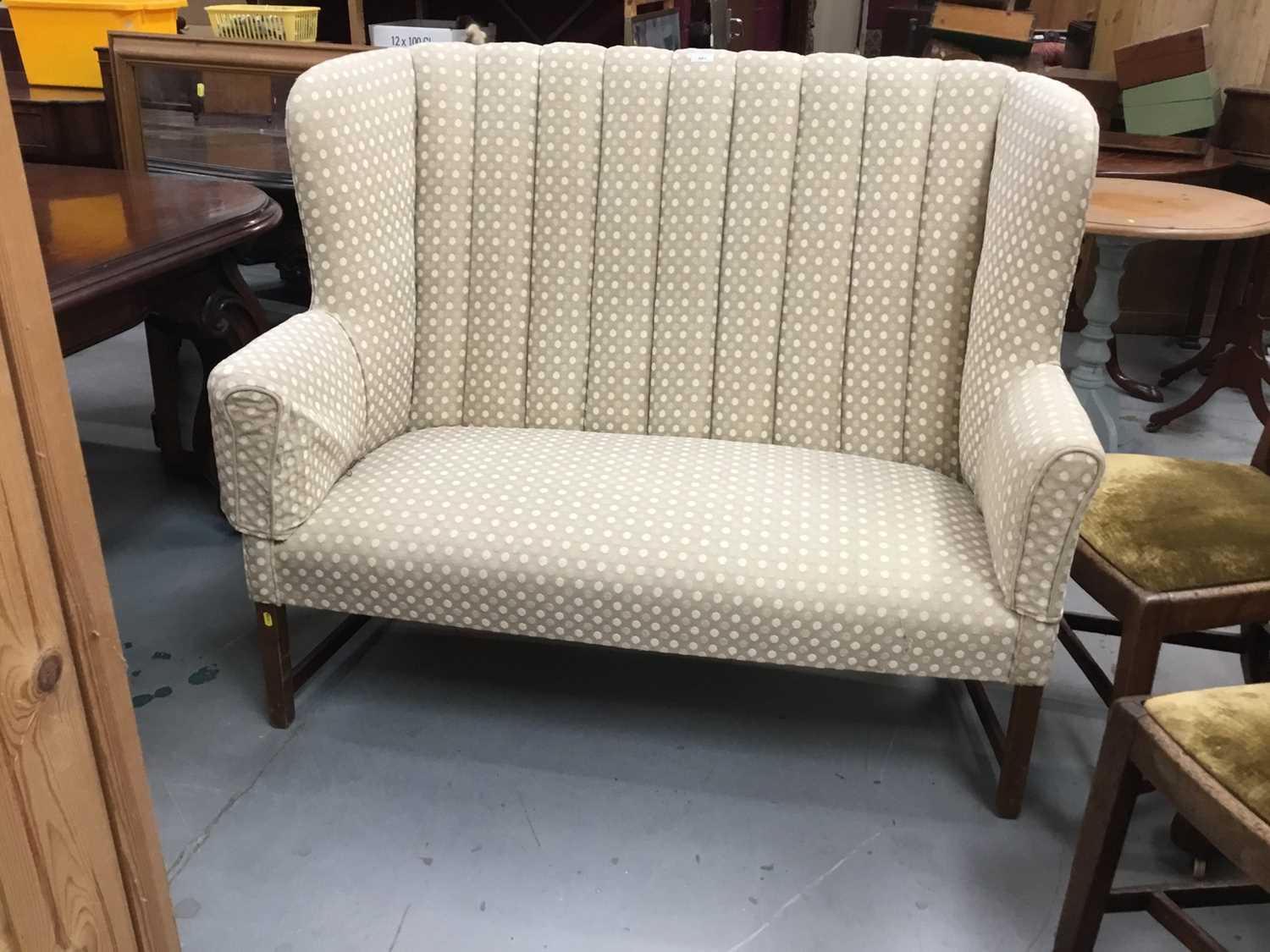 Lot 881 - Traditional high back sofa with polka dot upholstery, on square legs joined by stretchers