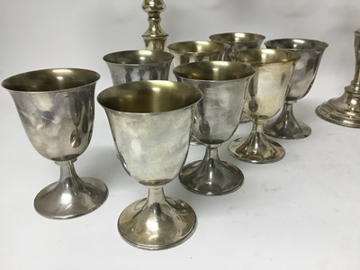 Lot 144 - Victorian silver plated melon shape teapot, two Edwardian silver plated entre dishes and covers, pair of silver plated candelabras and and a set of six silver plated goblets