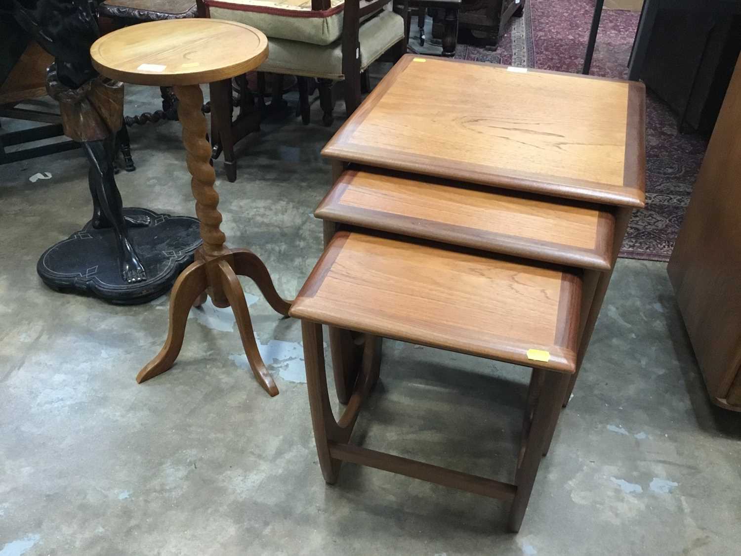 Lot 894 - Teak nest of three tables and oak wine table on spiral twist coloumn