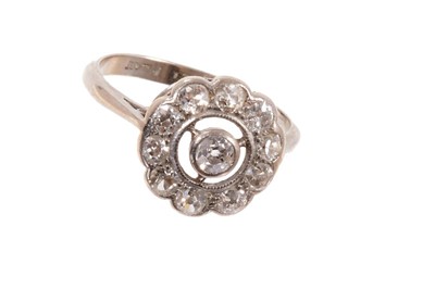 Lot 601 - Antique diamond cluster ring with a circular target shape cluster of old cut diamonds