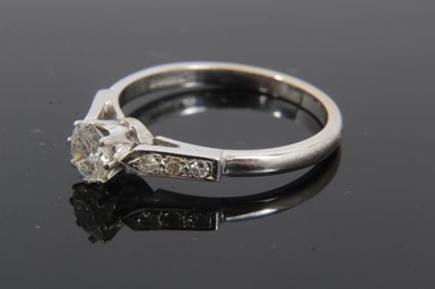 Lot 122 - 18ct white gold diamond solitaire ring with diamond set shoulders