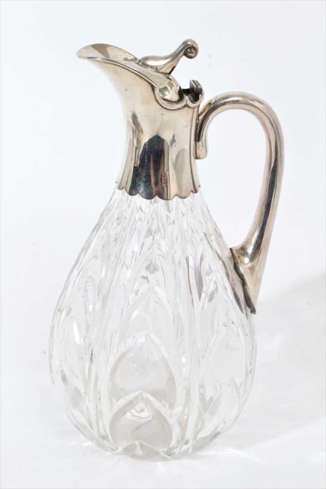 Lot 349 - Edwardian silver mounted cut glass claret jug, with leaf pattern decoration.