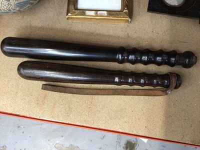 Lot 88 - Two Metropolitan policeman's turned lignum vitae truncheons, for a Police Constable and Detective Constable (2)