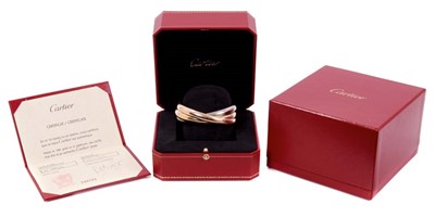 Lot 631 - Cartier Trinity three colour 18ct gold bangle in original box with receipt