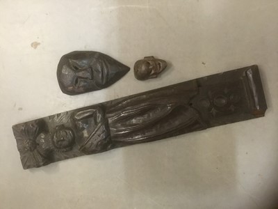 Lot 382 - 19th century carved  oak panel together with two Nepalese tribal masks