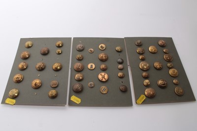 Lot 685 - Three boards of military buttons together with a group of other military badges and buttons