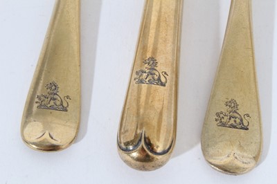 Lot 362 - Early George V silver gilt dessert knife, fork and spoon with engraved lion crests.