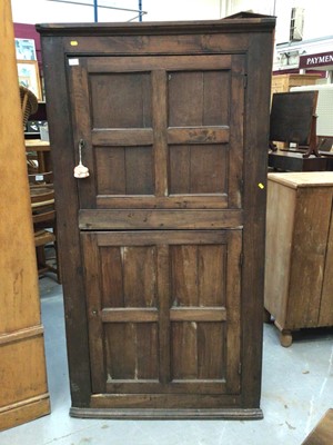Lot 964 - Early 19th century oak two height corner cupboard with panelled doors 183 cm high, 96 cm wide