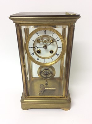 Lot 761 - Late 19th century French brass four glass  mantle clock with key and pendulum