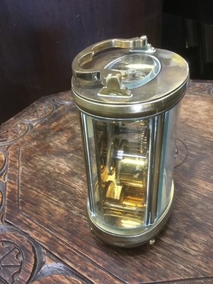 Lot 161 - Modern brass oval form carriage clock