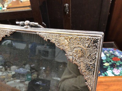 Lot 39 - Eastern white metal plated photograph frame with relief decoration, 26cm high