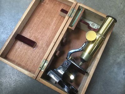 Lot 263 - Student microscope, cased, with small group of slides