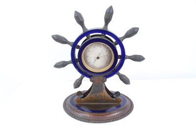 Lot 2215 - Unusual desk top barometer in the form of a ships wheel with enamel decoration