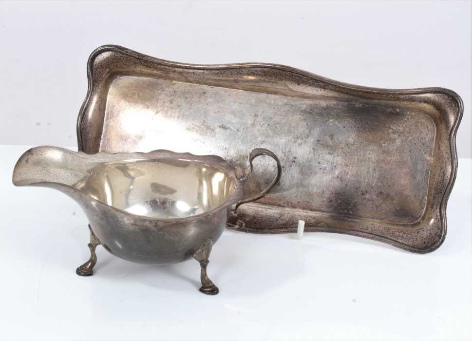 Lot 43 - Silver sauce boat together with a silver pen tray (2)