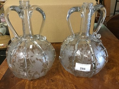 Lot 286 - Pair of 19th century Venetian etched glass decanters with applied handles
