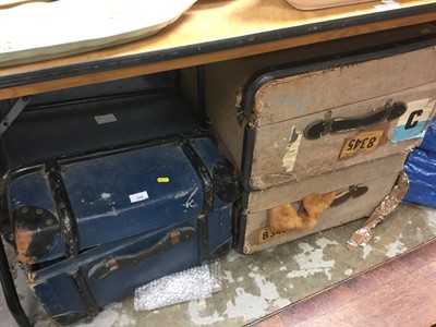 Lot 318 - Three Canvas bound trunks containing vintage clothing together with a bag of assorted vintage clothing