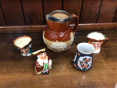Lot 341 - Doulton Lambeth harvest jug with silver mounted rim, two Doulton character jugs, a further character jug and a Japanese vase (5)