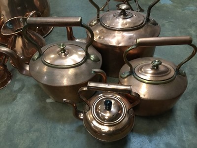 Lot 321 - Three antique copper kettles and various antique copper measures