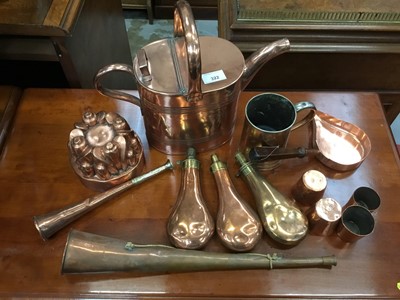 Lot 322 - Antique copper watering can, three antique copper gun powder flasks, antique copper jelly mould and various items of antique copper