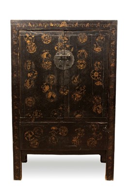 Lot 1305 - Late 19th / early 20th century Chinese black lacquered cabinet, enclosed by pair of gilt decorated doors, raised on stiles, 103cmnwide x 50cm deep x 161cm high