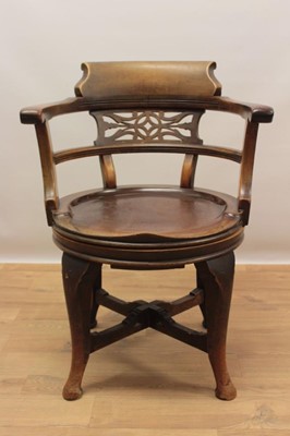 Lot 1308 - Early 20th century mahogany revolving desk chair