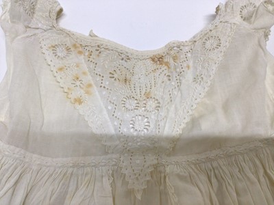 Lot 1929 - Antique White work Christening Gown with petticoat and embroidered cream wool shawl. Also an appliqued net lace wedding dress train, motifs include Thistles, Lily of the Valley, Bows and Shamrock....