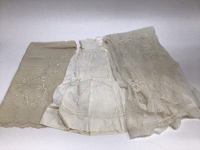 Lot 1929 - Antique White work Christening Gown with petticoat and embroidered cream wool shawl. Also an appliqued net lace wedding dress train, motifs include Thistles, Lily of the Valley, Bows and Shamrock....