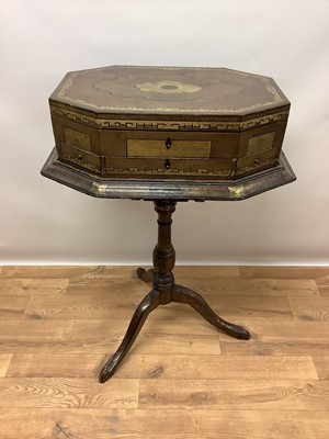 Lot 1341 - George III Anglo-Chinese papier mâché work box on stand, the work box of canted form the hinged top centred by initialled oval cartouche, enclosing fitted interior of compartments, some lidded and...