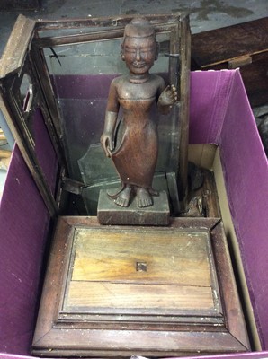 Lot 361 - Antique Indian carved wood figure with a wood and glass panelled stand/case (damaged)