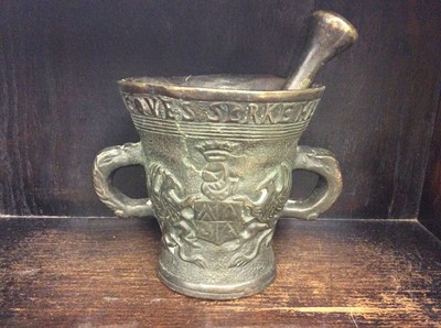 Lot 359 - 17th century style continental bronze pestle and mortar with armorial decoration