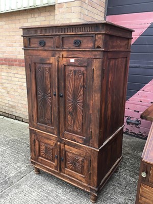 Lot 299 - Eastern cupboard with two top drawers and four fluted and panelled doors below 89 cm wide, 163 cm high 
.